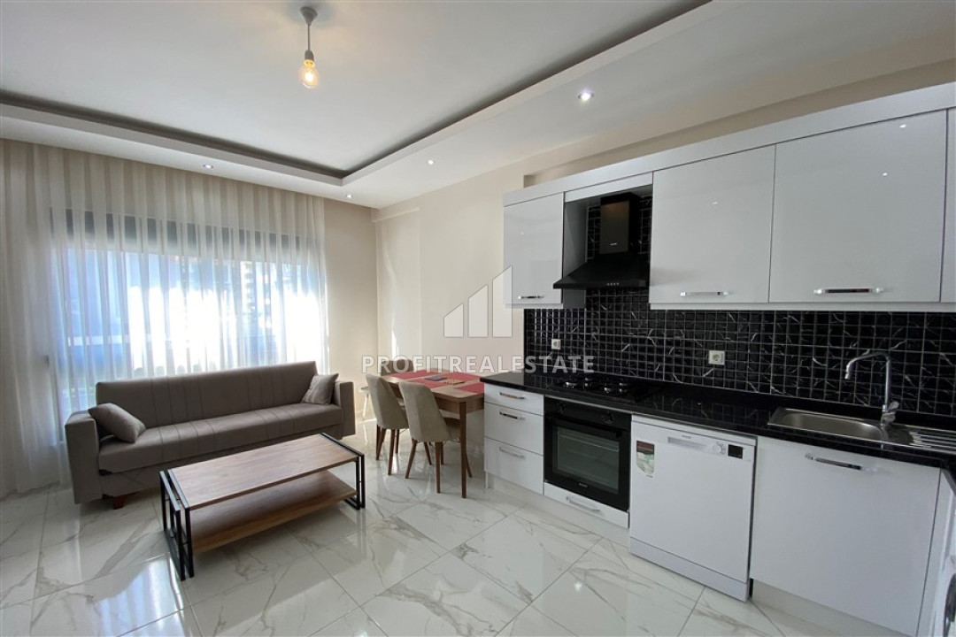 Симпатичная меблированная двухкомнатная квартира, 56м², в новом комплексе в 200м от моря в районе Кестель ID-12835 фото-2