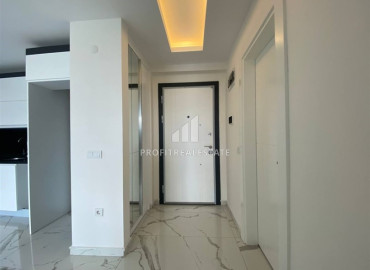 One-bedroom apartment, 52m², on the high floor of an elite new building in Mahmutlar, 500m from the sea, Alanya ID-12838 фото-4