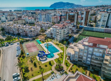 One-bedroom apartment with access to the garden, 75m², in a comfortable residence in a quiet area of Alanya - Cikcilli ID-12839 фото-2