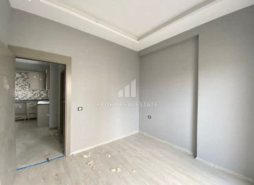 Двухкомнатная квартира, 65м², на высоком этаже в 400м от моря в Эрдемли, Арпачбахшиш ID-12870 фото-12