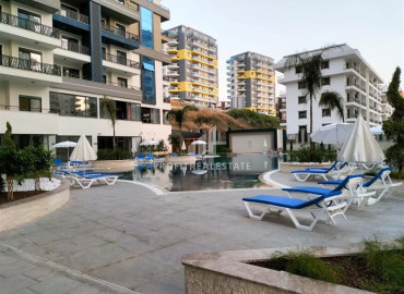 Furnished one-bedroom apartment 58m2, in a residence with developed facilities in Mahmutlar, Alanya ID-12957 фото-1