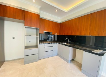 Новая двухкомнатная квартира 63 м2, с чистовой отделкой, без мебели, в 300 метрах от моря в Каргыджаке, Аланья ID-13062 фото-3