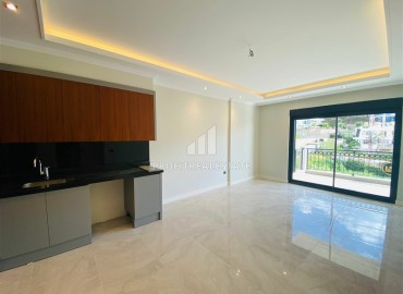 Новая двухкомнатная квартира 63 м2, с чистовой отделкой, без мебели, в 300 метрах от моря в Каргыджаке, Аланья ID-13062 фото-5