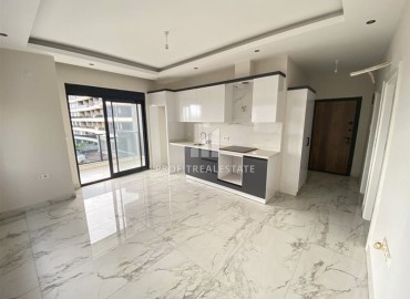 One-bedroom apartment in a new building 55 m2, with a fine finish, unfurnished, 200 meters from the sea in Kargicak, Alanya ID-13078 фото-8