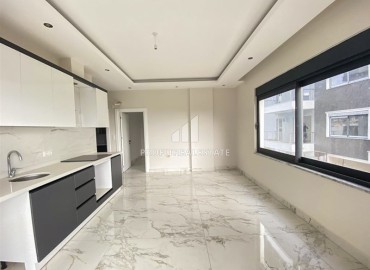 Двухкомнатная квартира в новостройке 55 м2, с чистовой отделкой, без мебели, в 200 метрах от моря в Каргыджаке, Аланья ID-13078 фото-10