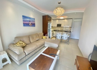 Elegant one-bedroom apartment 55 m2, 500 meters from the sea, in a luxurious residential residence in Mahmutlar, Alanya ID-13080 фото-1