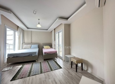 Просторная квартира с двумя спальнями, 115м² в 450м от моря в районном центре Эрдемли, Арпачбахшиш ID-13107 фото-18