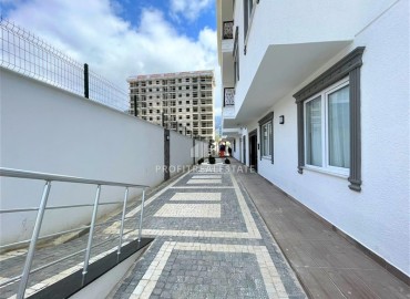 Двухкомнатные апартаменты, с профессиональным дизайном, в новой резиденции Махмутлара, Аланья, 55 м2 ID-13152 фото-15