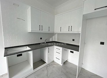 Недорогая двухкомнатная квартира 50 м2, без мебели, с кухонным гарнитуром, в комплексе с инфраструктурой в Авсалларе, Аланья ID-13157 фото-4