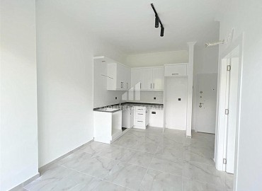 Недорогая двухкомнатная квартира 50 м2, без мебели, с кухонным гарнитуром, в комплексе с инфраструктурой в Авсалларе, Аланья ID-13157 фото-6