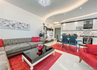Elegant furnished two-bedroom apartment, 119m², in a luxury residence in Mahmutlar, Alanya ID-13160 фото-1