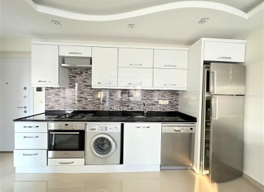 Элегантные меблированные двухкомнатные апартаменты 70 м2, в 200 метрах от моря, в Махмутларе, Аланья ID-13288 фото-5