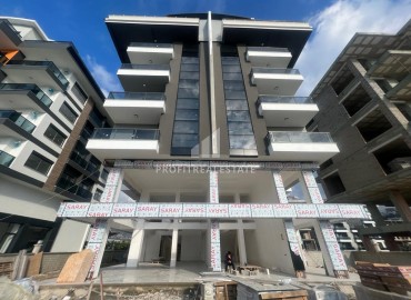 Двухкомнатные апартаменты, 51м², на окончательном этапе строительства, в 150м от моря в районе Каргыджак, Алания ID-12512 фото-1
