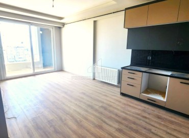 Просторная квартира с одной спальней, 71м², в новом комплексе в районе Томюк, Мерсин ID-13450 фото-3