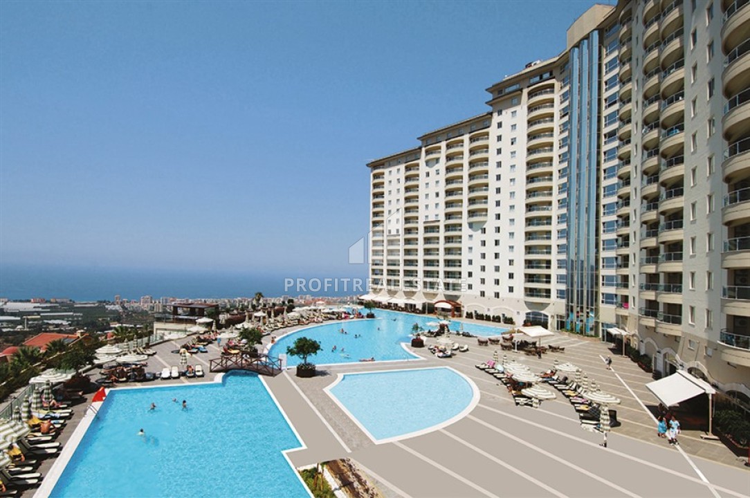 Двухкомнатная меблированная квартира 95м2, с панорамным видом на море, в комплексе с инфраструктурой отеля, Каргыджак, Аланья ID-13471 фото-1