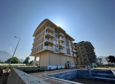 Новая двухкомнатная квартира, 61м², в комплексе с крытым бассейном в районе Алании – Каргыджак, 350м от моря ID-13525 фото-14