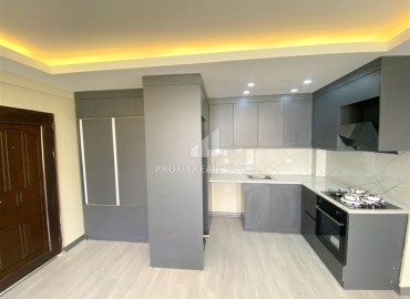 One-bedroom apartment by the sea, 65 m2, unfurnished, with a fine finish, kitchen and bathroom equipment, in Oba, Alanya ID-13540 фото-3