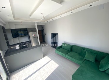 Квартира с одной спальней, 55м², в новом комфортабельном комплексе в районе Томюк, Мерсин ID-13579 фото-3