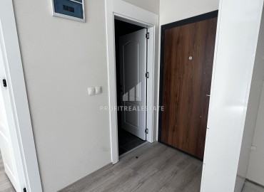Двухкомнатные апартаменты, 65м², в строящемся комплексе с бассейном в районе Томюк, Мерсин ID-13583 фото-6