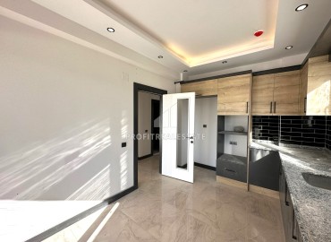 Квартира с двумя спальнями и отдельной кухней, 100м², в новостройке в 650м от моря в районе Мерсина Давултепе ID-13627 фото-4