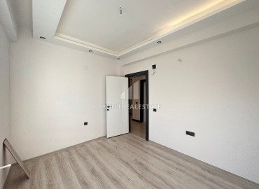 Квартира с двумя спальнями и отдельной кухней, 100м², в новостройке в 650м от моря в районе Мерсина Давултепе ID-13627 фото-12