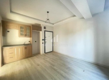 Компактные апартаменты с одной спальней, 45м², в новом доме в 80м от моря, в центре Тедже, Мерсин ID-13630 фото-3
