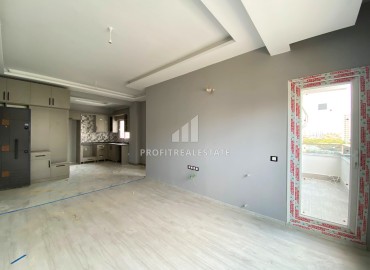 Двухкомнатная квартира, 60м², в новостройке в 300м от моря в Эрдемли, Арпачбахшиш ID-13639 фото-8