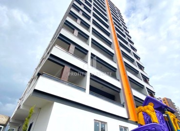 Двухкомнатная квартира, 60м², в новостройке в 300м от моря в Эрдемли, Арпачбахшиш ID-13639 фото-15