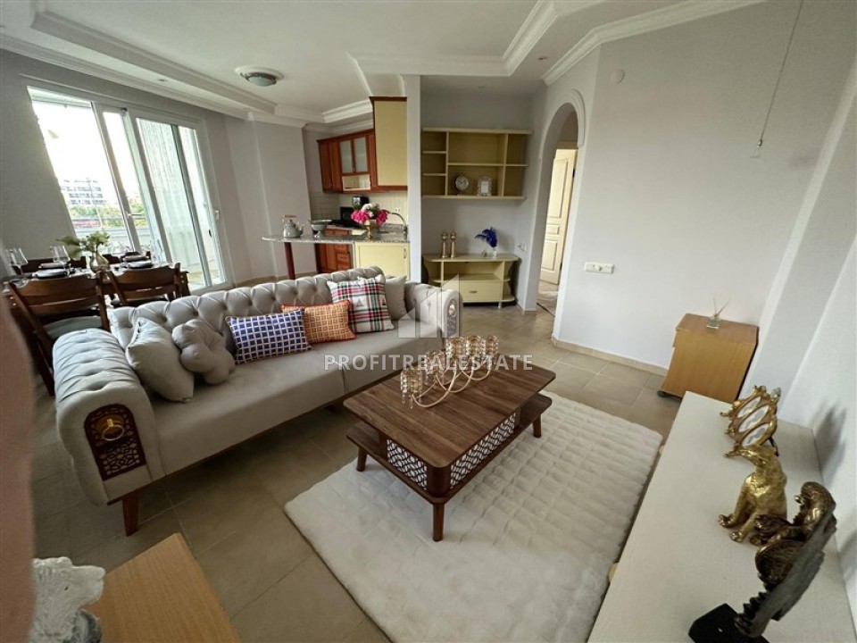 Меблированная двухкомнатная квартира, 55м², в уютной резиденции, в 350м от моря в районе Алании Тосмур ID-13650 фото-1