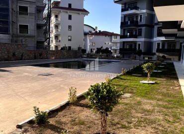 One-bedroom apartment 52 m2, unfurnished, in a residence with facilities, in Oba, Alanya ID-11332 фото-9