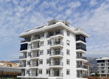 Двухкомнатная квартира в новостройке, 50 м2, без мебели, в 300 метрах от моря, в комплексе с инфраструктурой в Каргыджаке, Аланья ID-13662 фото-1