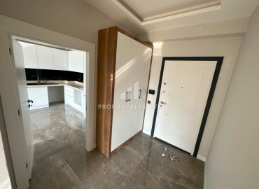 Комфортабельная квартира с двумя спальнями, 100м², в новой резиденции в 400м от моря в Тедже, Мерсин ID-13665 фото-2