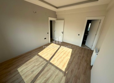Комфортабельная квартира с двумя спальнями, 100м², в новой резиденции в 400м от моря в Тедже, Мерсин ID-13665 фото-14