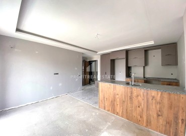 Двухкомнатная квартира, 55м², в комплексе с бассейном на этапе ввода в эксплуатацию в Эрдемли, Арпачбахшиш ID-13726 фото-5