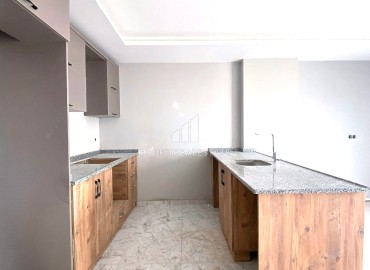 Двухкомнатная квартира, 55м², в комплексе с бассейном на этапе ввода в эксплуатацию в Эрдемли, Арпачбахшиш ID-13726 фото-9