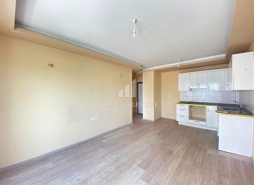 Двухкомнатные апартаменты, 55м², в доме городского типа в районе Томюк, Мерсин, по привлекательной цене ID-13727 фото-4