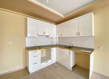Двухкомнатные апартаменты, 55м², в доме городского типа в районе Томюк, Мерсин, по привлекательной цене ID-13727 фото-5