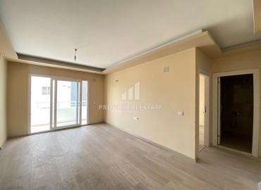 Двухкомнатные апартаменты, 55м², в доме городского типа в районе Томюк, Мерсин, по привлекательной цене ID-13727 фото-6