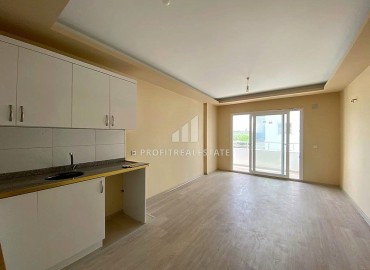 Двухкомнатные апартаменты, 55м², в доме городского типа в районе Томюк, Мерсин, по привлекательной цене ID-13727 фото-7