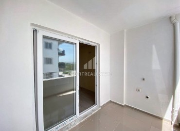 Двухкомнатные апартаменты, 55м², в доме городского типа в районе Томюк, Мерсин, по привлекательной цене ID-13727 фото-8