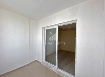 Двухкомнатные апартаменты, 55м², в доме городского типа в районе Томюк, Мерсин, по привлекательной цене ID-13727 фото-13
