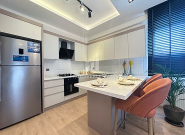 Двухкомнатная квартира, 55м², в комплексе на этапе ввода в эксплуатацию в 500м от моря в Эрдемли, Арпачбахшиш ID-13765 фото-4
