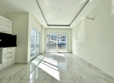 Двухкомнатные апартаменты 55м2, в новостройке, с чистовой отделкой и кухонным гарнитуром, в 300 метрах от моря в Кестеле, Аланья ID-13768 фото-3