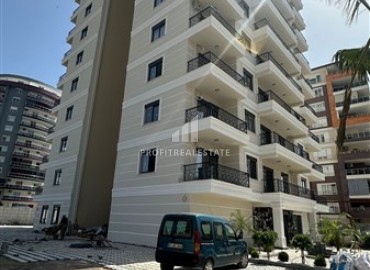 Новые двухкомнатные апартаменты в резиденции с развитой инфраструктурой, в 200 метрах от центра Махмутлара, Аланья, 60 м2 ID-13780 фото-1