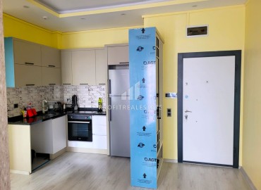 Furnished two bedroom apartment, 90m², in a new residence with a swimming pool, in the area of Mersin - Mezitli ID-13233 фото-6