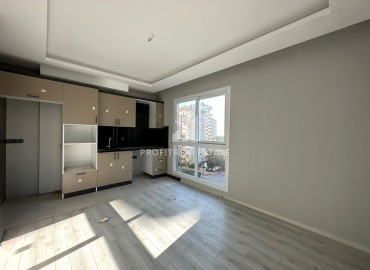 One-bedroom apartment, 55m², in a new urban-type building in Tomuk, Mersin ID-13845 фото-6