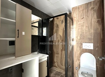 Квартира с одной спальней, 55м², в новом доме городского типа в районе Томюк, Мерсин ID-13845 фото-9