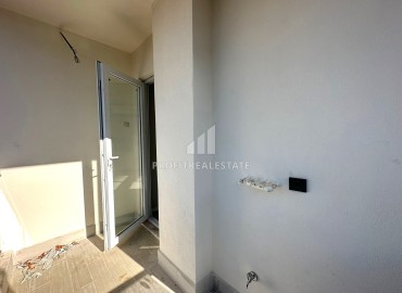 One-bedroom apartment, 55m², in a new urban-type building in Tomuk, Mersin ID-13845 фото-10