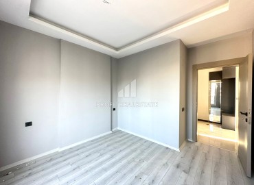 Квартира с одной спальней, 55м², в новом доме городского типа в районе Томюк, Мерсин ID-13845 фото-11