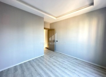 Квартира с одной спальней, 55м², в новом доме городского типа в районе Томюк, Мерсин ID-13845 фото-12